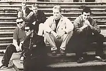 Black and white image of The Farm sitting on steps