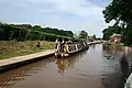 A steam powered narrow boat waiting atop the Tyrley Locks