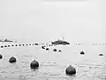 HMS Rogate, a Royal Navy "gate vessel" designed to open and close the boom and nets at Portsmouth Harbour during World War II.