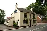 The two storey Ship Inn public house.