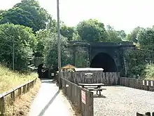 A shot of two stone railway tunnels side by side