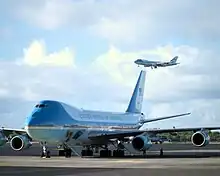 Air Force One (in air) and its backup on the ground during a 2003 visit by George W. Bush