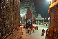 Temple tower with people passing through.