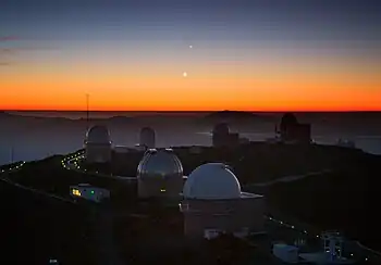 Jupiter (top), Venus (left), and Mercury (right) nearly align themselves in the sky.