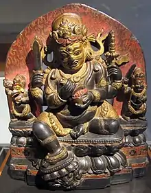 Apart from the three figures, the pendent foot of this 12th-century Tibetan Mahakala has its own throne