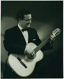 Tony Bradan in 1968, playing classical guitar