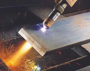 Close up of a Hypertherm HyPerformance plasma torch cutting metal