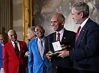 McGee, second from left, receiving the Congressional Gold Medal with other Tuskegee Airmen in 2007