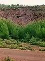 Iron mine at Tzines, with paleolithic mine-tunnel