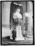 Statue of Thales representing electricity being hoisted up