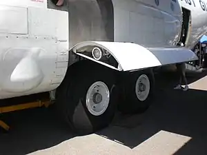 High-wing cargo aircraft have pontoons for the main gear.