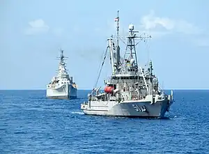 USNS Grasp (T-ARS-51), a Safeguard-class rescue and salvage ship, tows ex-USS Des Moines (CA-134) to the scrapyard in Texas