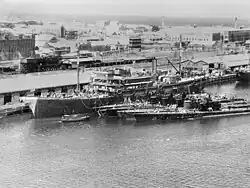 The submarine tender USS Holland with five American submarines at Fremantle submarine base in 1942