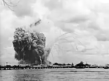 USS Mount Hood explodes: the smoke trails are left by fragments ejected by the explosion.