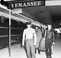 A U.S. Marine with recruits at Yemassee train station, date unknown.