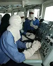 The Pakistan Navy's enlists wearing the anti-flash gear observing the VBSS drill under the Pakistan Navy SSGN and the U.S. Navy SEALs during CTF-150 operations in the Gulf of Oman in 2005.