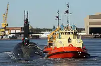 USS Rhode Island (SSBN-740) being escorted by tug boats to Kings Bay.