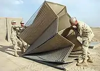 United States Navy Seabees assembling HESCO MIL units