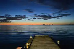 Twilight evening view into the sea (Mona Passage) and the horizing from the shore at Joyuda, Puerto Rico,