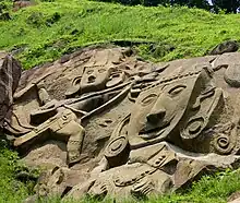 Rock cut bas relief of Hindu deity