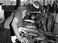 Veronica Foster inspects a lathe at the John Inglis & Co. Bren gun plant, May 1941