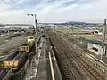 A view of the platforms and tracks. Platform 1 is to the left. Note the siding branching off track 1.