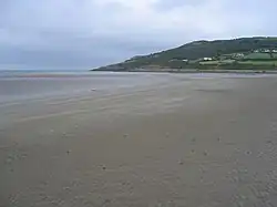 Red Wharf Bay with fish weir in the distance