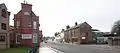 Looking south of the main road through Cotton End south from South Bridge. The road here is known as 'Cotton End' from the bridge as far as the furthest traffic lights and most visitor's first view of the town centre from the south