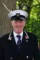 Swan marker of the Worshipful Company of Vintners, in his blue uniform, during 2011 swan upping, Abingdon.