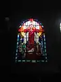 Stained glass window of Sacred Heart in Art Deco style