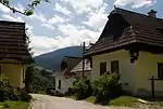 Village street with wooden houses on both sides