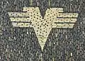 Former logo of the Volksbanken, displayed on a pavement in Freiburg im Breisgau