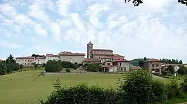 The church and surrounding buildings in La Chapelle-sur-Coise