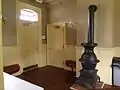 The waiting room of the Hopewell passenger station, complete with vintage stove.