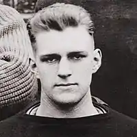 Carpenter cropped from team picture, sitting