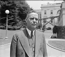 Rutledge stands outside the White House