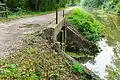 Concrete Waste weir. Note rods for attaching handles to control paddle valves.