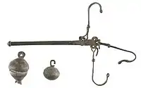 Roman steelyard balance with two bronze weights, 50–200 A.D., Gallo-Roman Museum, Tongeren, Belgium