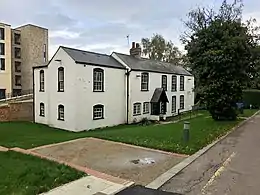 White Cottage with Mount Pleasant Halls in the background