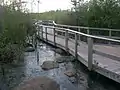 Boardwalk with 7 flood control gates open (equivalent).