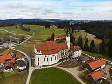 An aerial photo of a church in a countryside setting