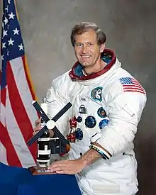 Pogue posing in his spacesuit