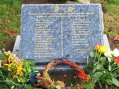 Commemorative plaque reads: "In memory of all those in Peebleshire persecuted under the 1563 Witchcraft Act including these 27 executed in 1629."