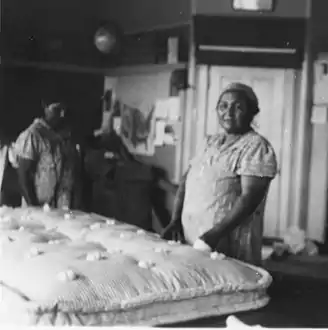 A tufted mattress, with through-stitches securing the filling