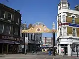 Woolwich New Road entrance with Victorian buildings and market portal