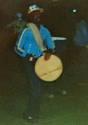 World Games I Women's Softball, Bahamas post-game celebration, August 1981. After the bronze-medal clinching women's softball game, Bahamian fans staged an impromptu celebration that wound its way around the perimeter of the field, with continual singing, dancing, music and Caribbean beats.