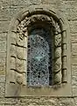 A window of St Mary's Church, surrounded with reliefs of shells and pine cones