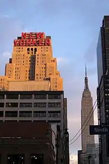 The New Yorker Hotel as seen from Ninth Avenue. The Empire State Building is at right.