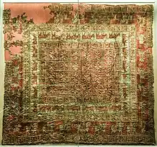 Decorated carpet from Pazyryk-5, of Near-Eastern origin. This is the earliest surviving knotted-pile carpet.