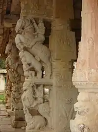 Pillars with Yali and Kudure Gombe ("horse doll") at Ranganatha temple, Rangasthala, Chikkaballapur district, Karnataka state, India